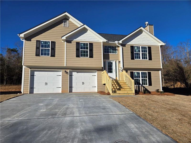 Front exterior of a new home in , Gainesville, GA, highlighting curb appeal (Image 1). Front exterior of a new home in , Gainesville, GA, highlighting curb appeal (Image 1).