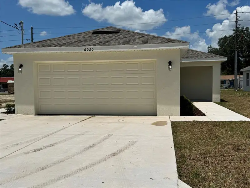 Front exterior of a new home in , Zephyrhills, FL, highlighting curb appeal (Image 1). Front exterior of a new home in , Zephyrhills, FL, highlighting curb appeal (Image 1).