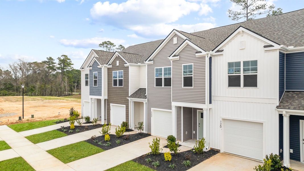 Front exterior of a new home in Marion Village, Santee, SC, highlighting curb appeal (Image 2). Front exterior of a new home in Marion Village, Santee, SC, highlighting curb appeal (Image 2).