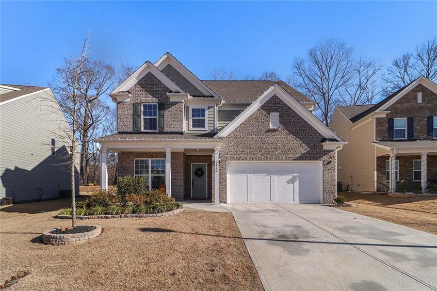 Front exterior of a new home in Pinebrook at Hamilton Mill, Auburn, GA, highlighting curb appeal (Image 22). Front exterior of a new home in Pinebrook at Hamilton Mill, Auburn, GA, highlighting curb appeal (Image 22).