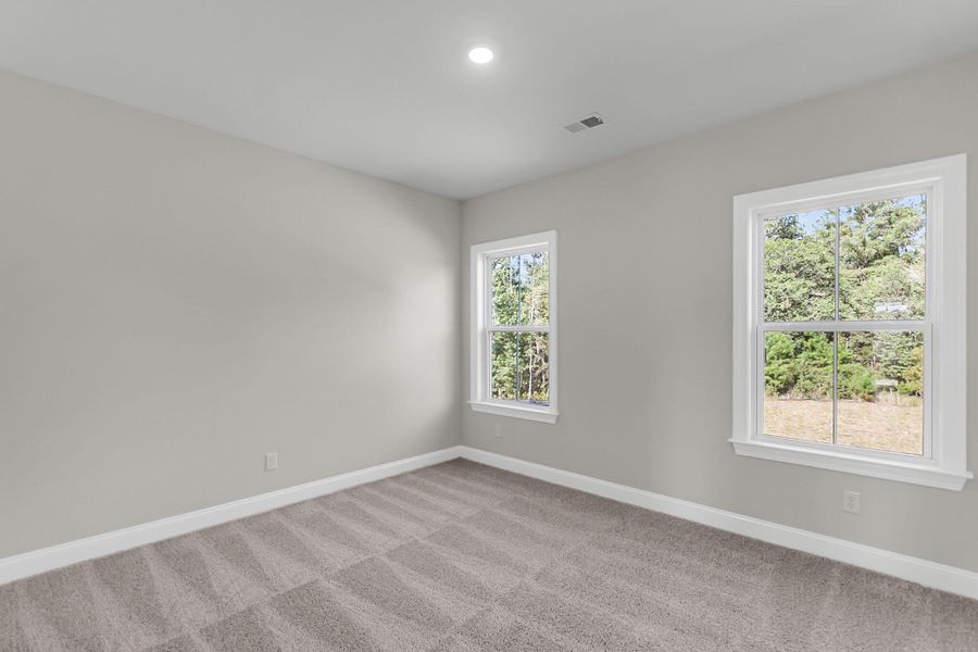 Spacious, unfurnished interior of a new home in Tidewater at Lakes of Cane Bay, Summerville (Image 14).
