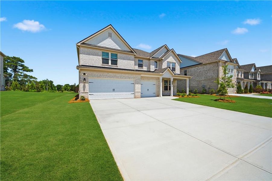 Front exterior of a new home in Adagio, Dacula, GA, highlighting curb appeal (Image 19).