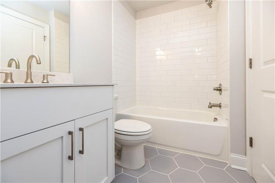 Full bathroom on the basement level. *Please note photos shown are of the Ellington plan but not of the actual home.