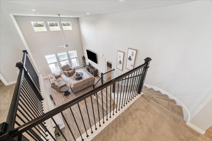 Spacious, open-concept living area with high ceilings, large windows providing abundant natural light. Spacious, open-concept living area with high ceilings, large windows providing abundant natural light.