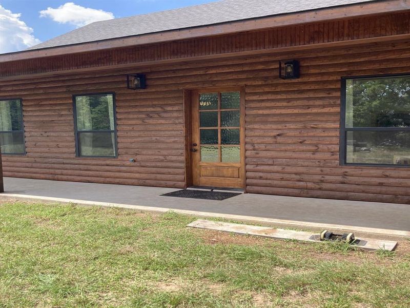 Front exterior of a new home in , Whitney, TX, highlighting curb appeal (Image 19).