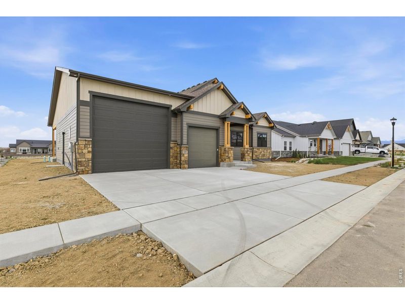 Front exterior of a new home in , Berthoud, CO, highlighting curb appeal (Image 28).