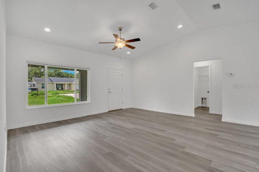 Living Room with View of Hallway to Laundry and Primary Bedroom