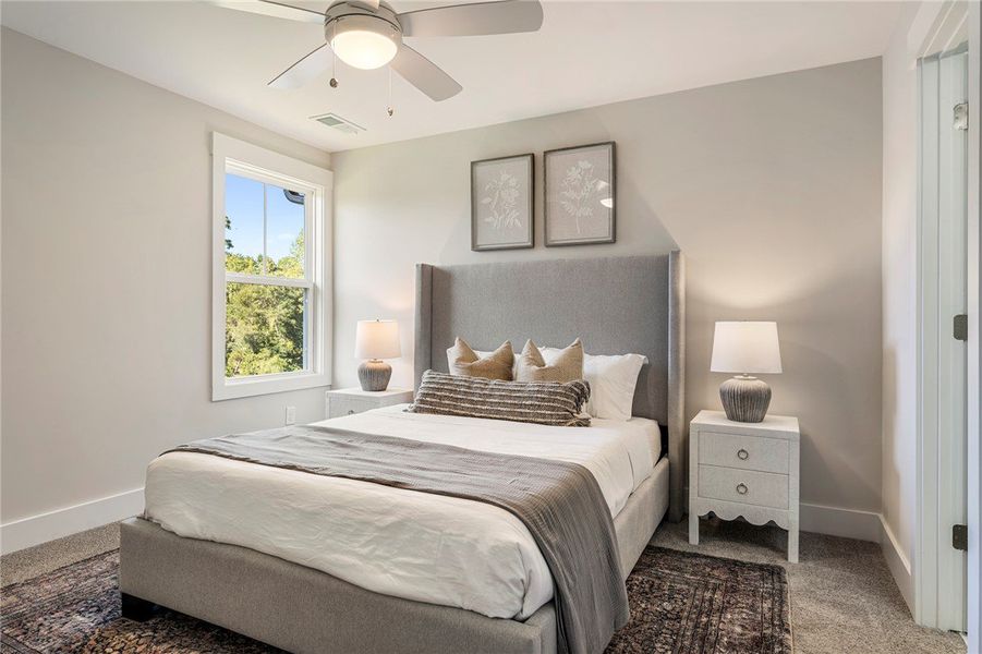 This airy bedroom offers serene comfort and abunda This airy bedroom offers serene comfort and abunda