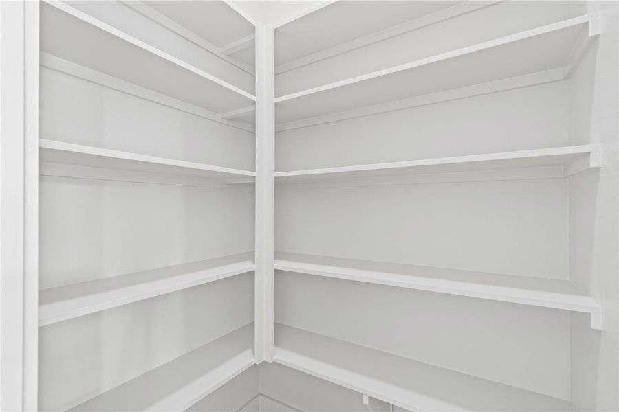 Built-in shelving lines your walk-in pantry. Built-in shelving lines your walk-in pantry.