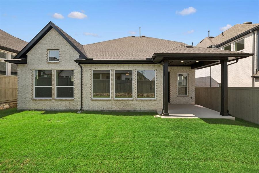 Front exterior of a new home in Pecan Square - Gardens, Northlake, TX, highlighting curb appeal (Image 1). Front exterior of a new home in Pecan Square - Gardens, Northlake, TX, highlighting curb appeal (Image 1).