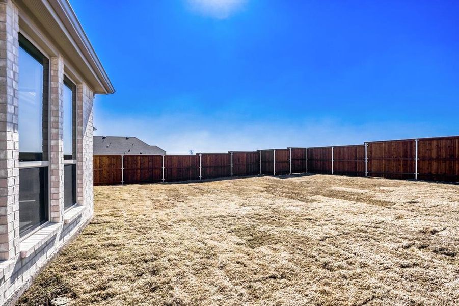 View of fenced backyard