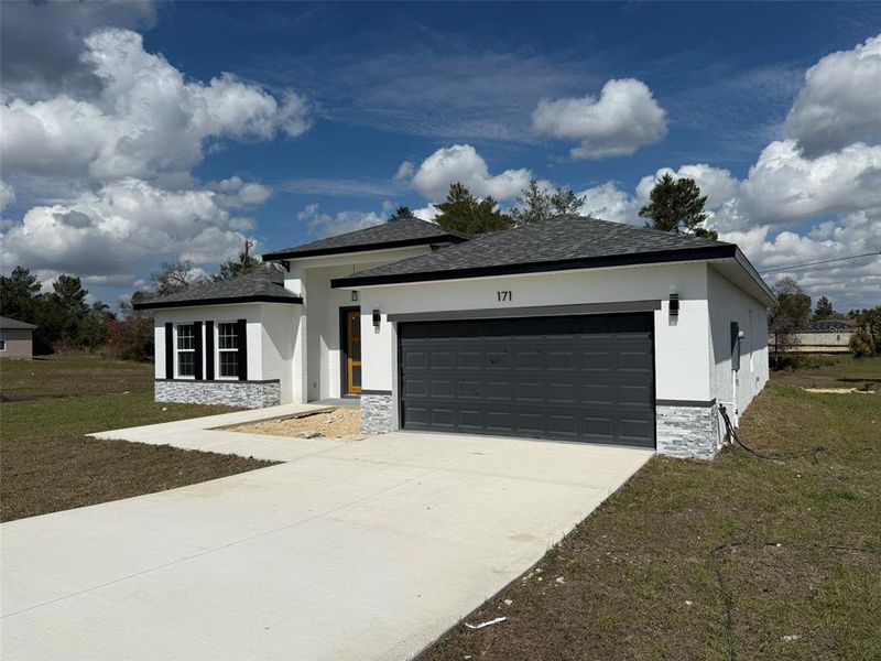 Front exterior of a new home in , Ocala, FL, highlighting curb appeal (Image 2).
