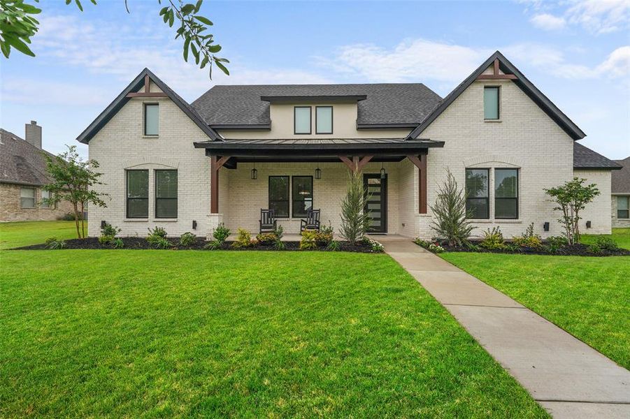 Front exterior of a new home in , Forney, TX, highlighting curb appeal (Image 24).