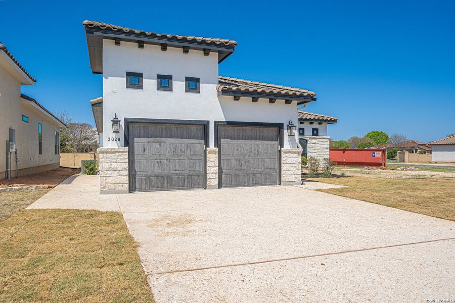 Front exterior of a new home in , Kerrville, TX, highlighting curb appeal (Image 19).