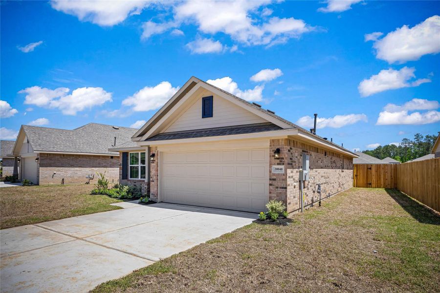 Front exterior of a new home in Grand Oaks Reserve, Cleveland, TX, highlighting curb appeal (Image 1). Front exterior of a new home in Grand Oaks Reserve, Cleveland, TX, highlighting curb appeal (Image 1).