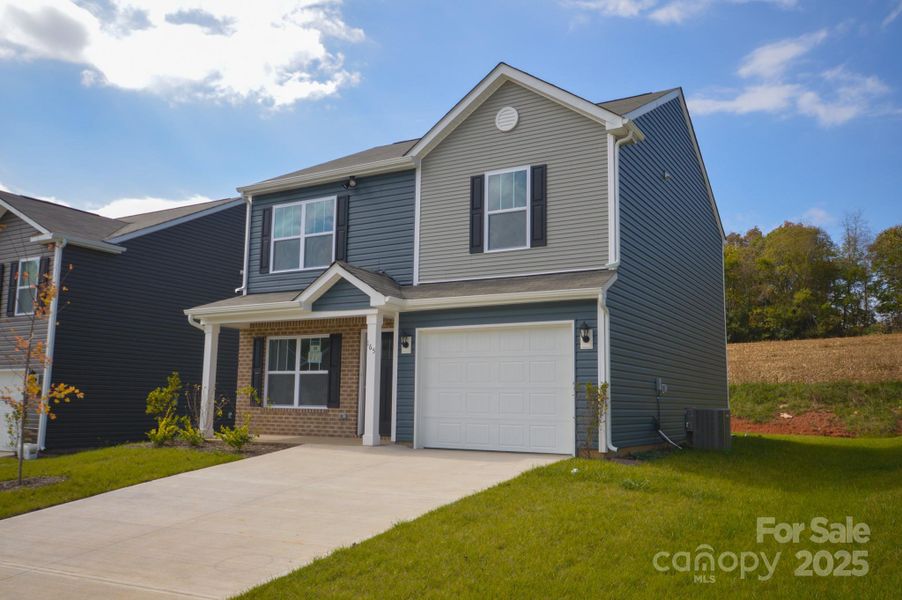 Front exterior of a new home in Patton Cove, Clyde, NC, highlighting curb appeal (Image 2).