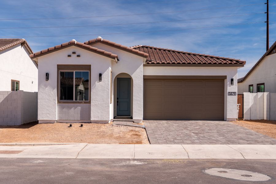 Front exterior of a new home in Waterston Central, Gilbert, AZ, highlighting curb appeal (Image 1). Front exterior of a new home in Waterston Central, Gilbert, AZ, highlighting curb appeal (Image 1).