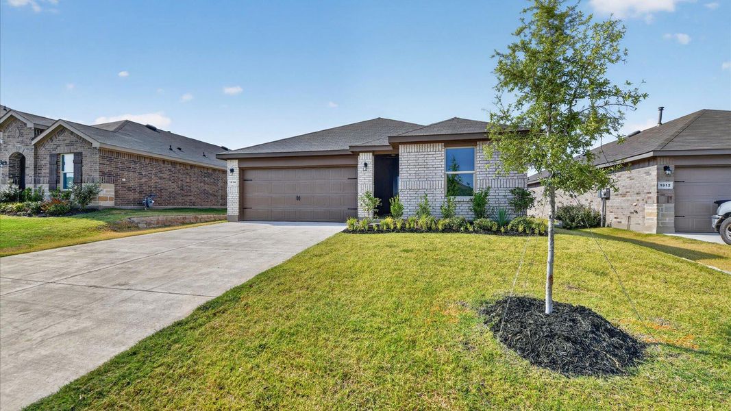 Front exterior of a new home in Legado, Cleburne, TX, highlighting curb appeal (Image 22).