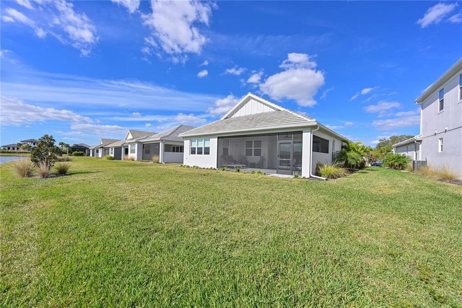 Exterior details and patio area of a home in LakeHouse Cove at Waterside, Sarasota (Image 25).