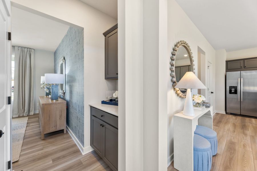 A room with a mirror and a table. A room with a mirror and a table.