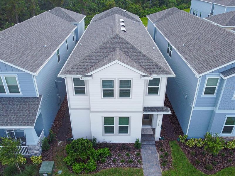 Front exterior of a new home in , Winter Garden, FL, highlighting curb appeal (Image 18).