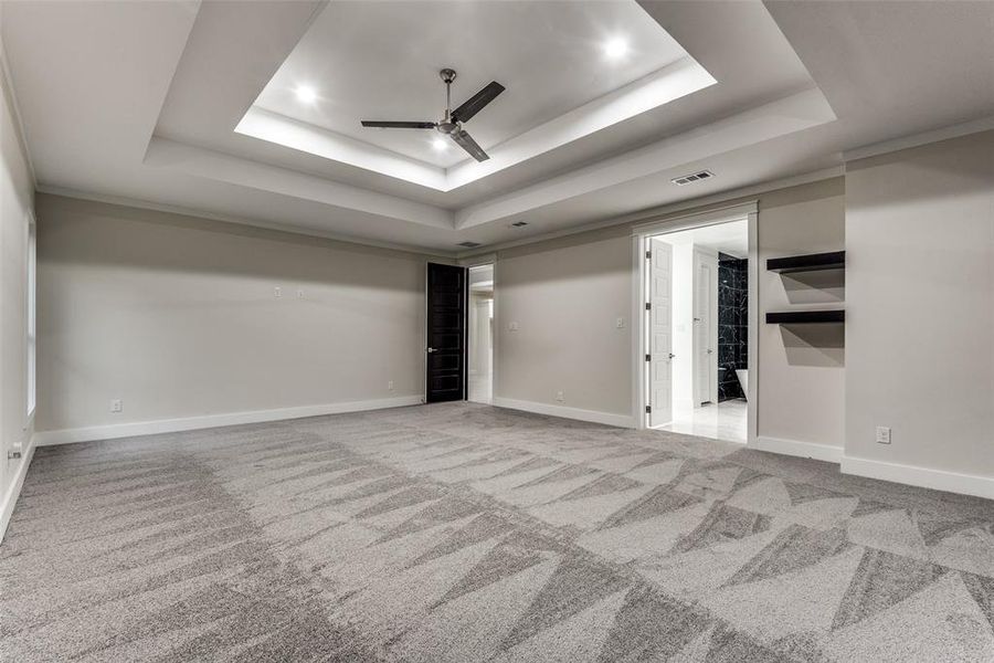 Massif Master bedroom with Accent Walls, Double Tray Ceilings, Shelves and French doors to a Massif Master bedroom that has a free standing tub and his and her separate walk-in-closets!!!