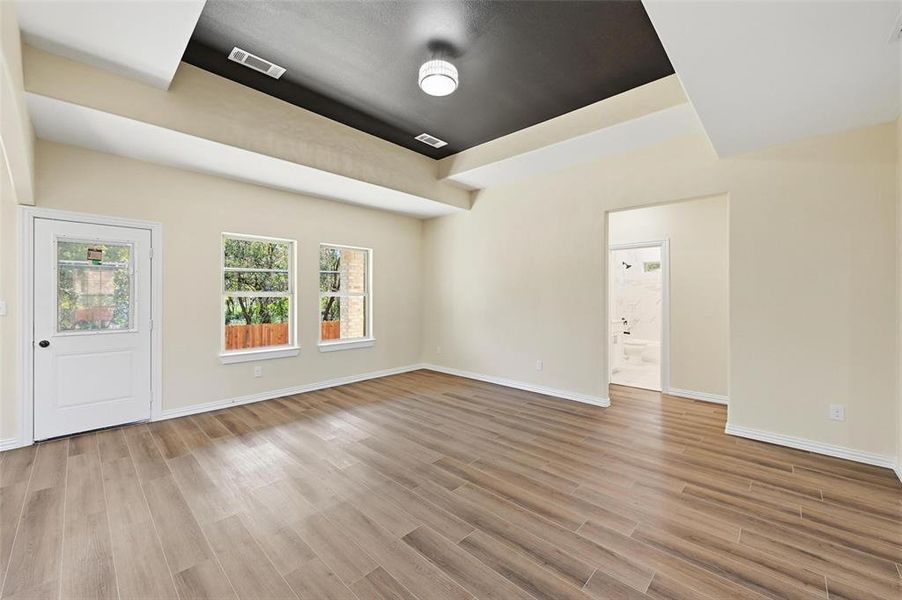 Empty room with light wood-type flooring and baseboards Empty room with light wood-type flooring and baseboards