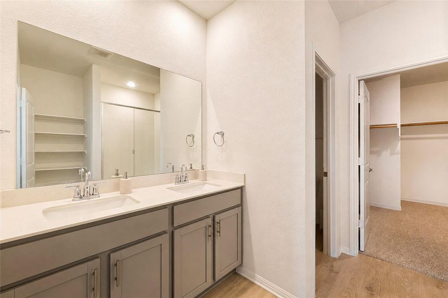 Primary bathroom featuring a dual vanity sinks with ample counter space