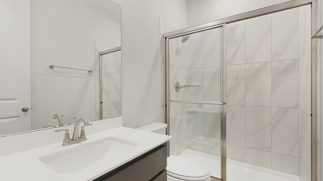 Representative furnished interior of a home built from the Brenner by Chesmar Homes in Newhaven, Manor (Image 5).