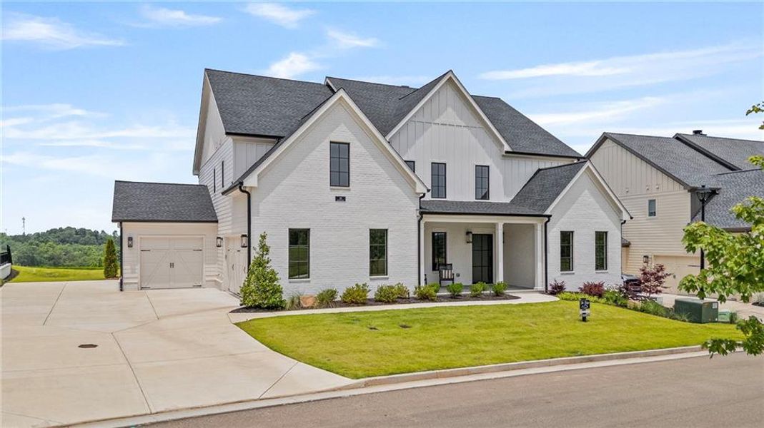 Front exterior of a new home in , Ball Ground, GA, highlighting curb appeal (Image 26).