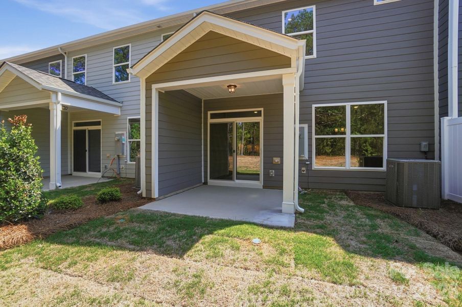 Exterior details and patio area of a home in Blythe Mill Townhomes, Waxhaw (Image 25).