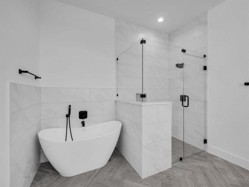 Bathroom with independent shower and bath and tile walls