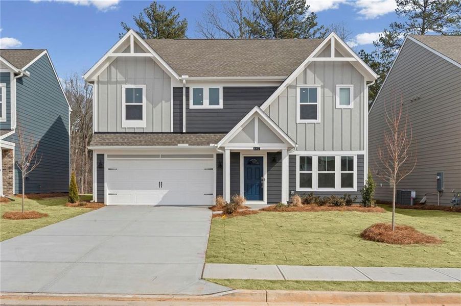 Front exterior of a new home in Twin Lakes, Hoschton, GA, highlighting curb appeal (Image 18).