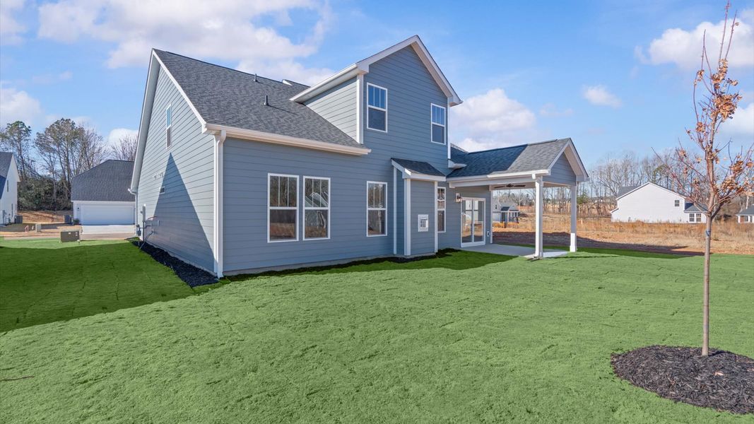 Accomplished exterior with a spacious rear porch that blends comfort and style