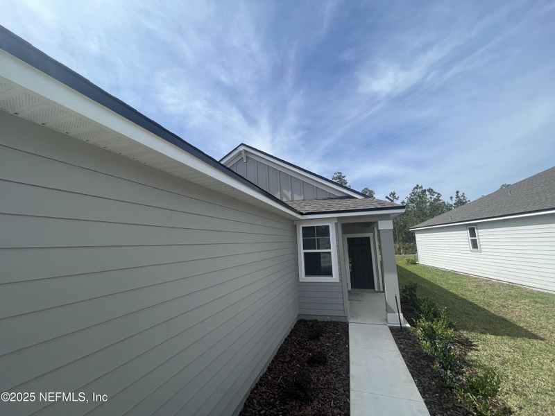 Exterior details and patio area of a home in Palm Series at Seminole Palms, Palm Coast (Image 3).
