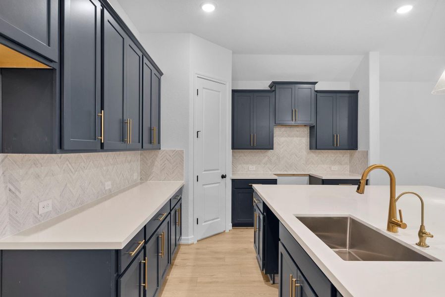 A thoughtfully designed kitchen with extensive counter space to support everything from food prep to hosting guests.