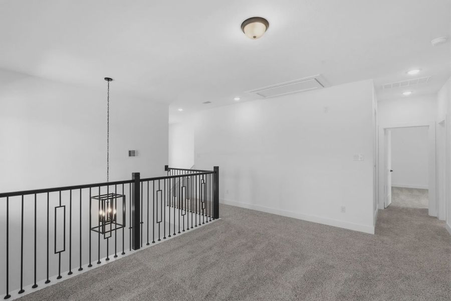 Representative unfurnished interior of a home built from the Sorenstam by Chesmar Homes in Riceland Alley Loads, Mont Belvieu (Image 64).