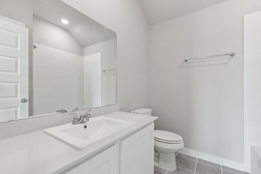 Bathroom in the Claret home plan by Trophy Signature Homes – REPRESENTATIVE PHOTO