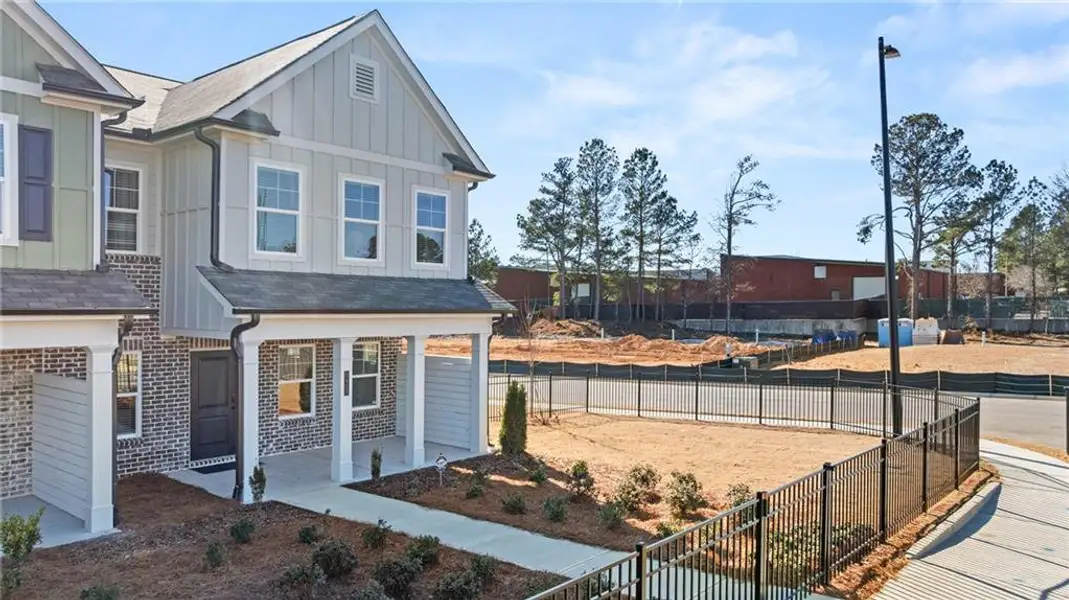 Front exterior of a new home in Lake Carlton, Loganville, GA, highlighting curb appeal (Image 23). Front exterior of a new home in Lake Carlton, Loganville, GA, highlighting curb appeal (Image 23).