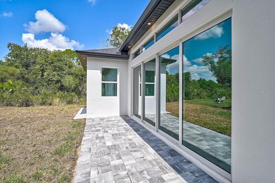 Exterior details and patio area of a home in , North Port (Image 32).