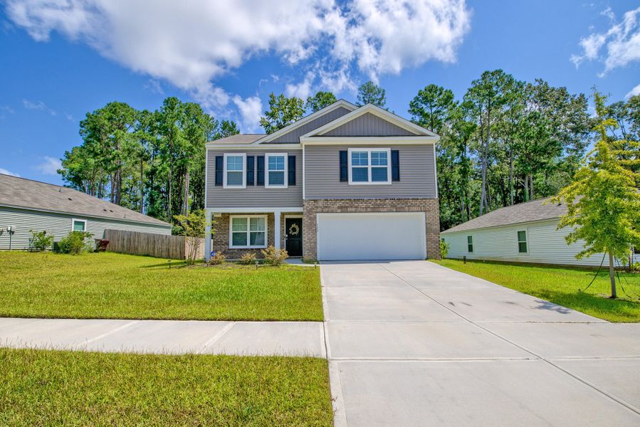 Front exterior of a new home in Stone Ridge, Moncks Corner, SC, highlighting curb appeal (Image 24).