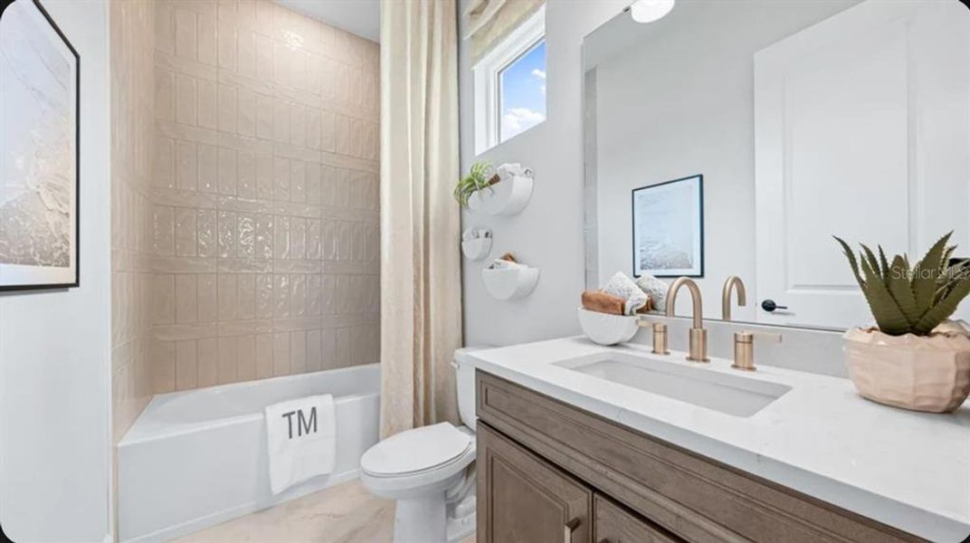 Furnished interior view inside a new home in Esplanade at Wellen Park, Englewood (Image 8).