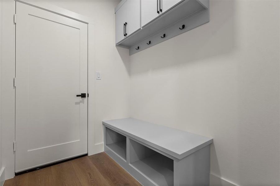 Mudroom with dark wood-type flooring