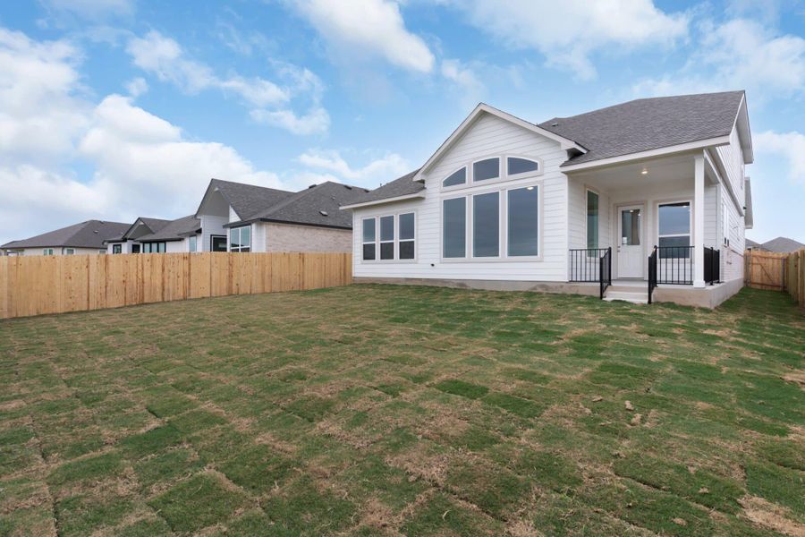 Exterior details and patio area of a home in Carillon, Manor (Image 3).