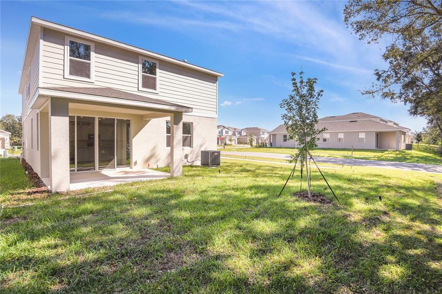 Exterior details and patio area of a home in Seasons at Shores of Lake Dell, Dundee (Image 4).