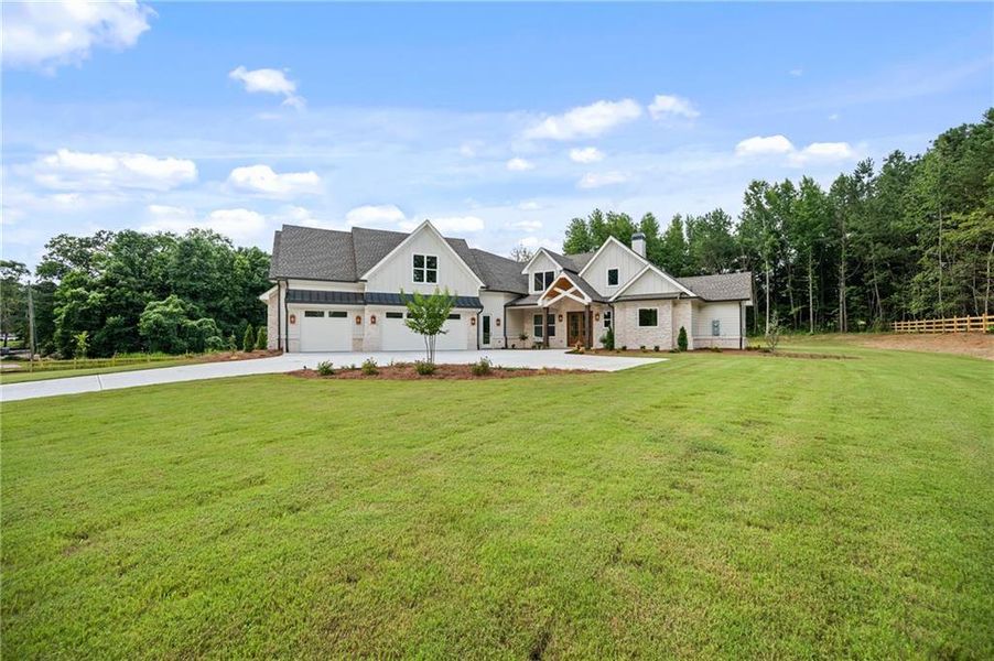 Front exterior of a new home in , Loganville, GA, highlighting curb appeal (Image 34). Front exterior of a new home in , Loganville, GA, highlighting curb appeal (Image 34).