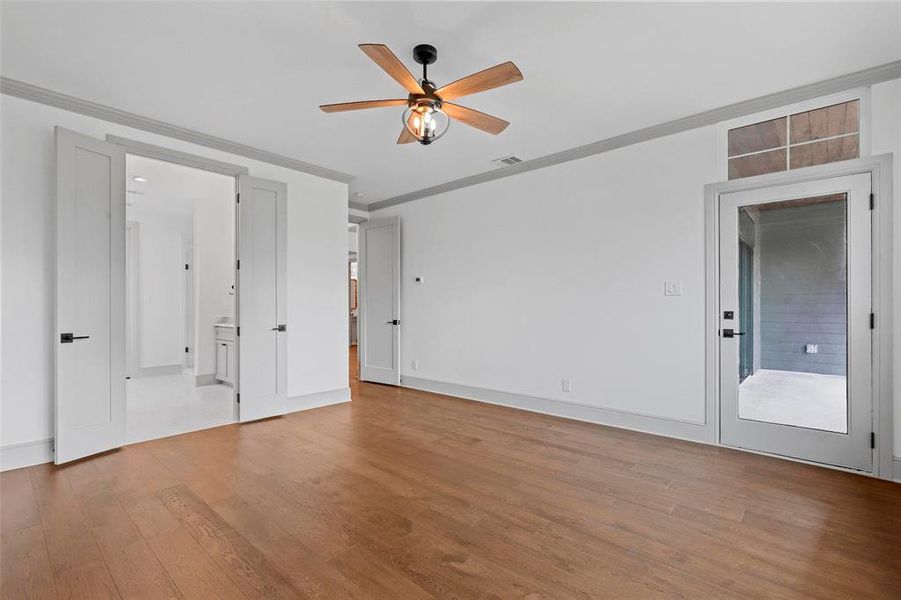 Unfurnished room with ornamental molding, ceiling fan, and light hardwood / wood-style floors