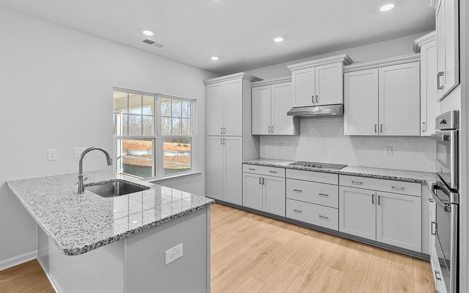 Furnished interior view inside a new home in Brayden, Advance (Image 8).