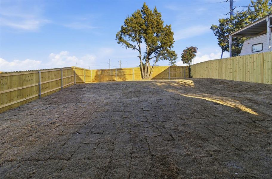 View of fenced backyard