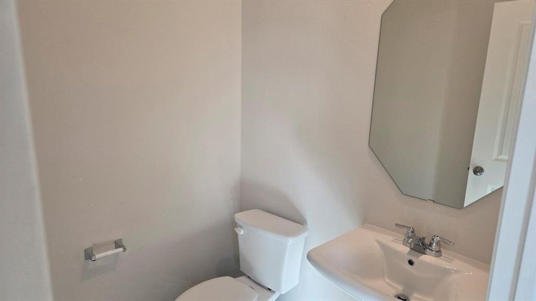 Bathroom with a sink and toilet